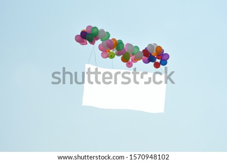 A white announcement tag tied to a balloon Float up to the sky And have space to put images and advertising text
