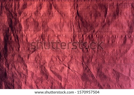 Red crumpled polyethylene film texture