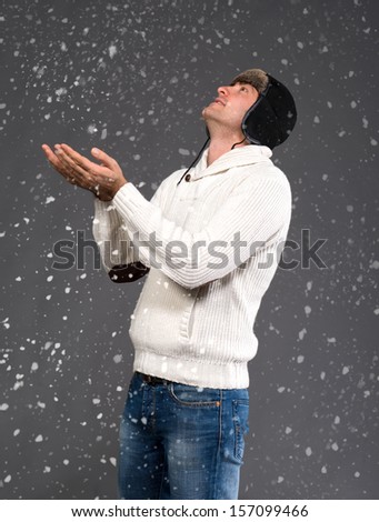 Picture of handsome man in warm sweater and hat 
