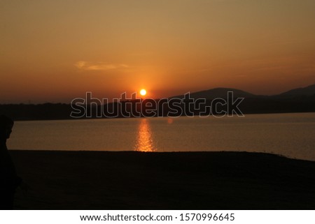 sunset glow of the sun over lake