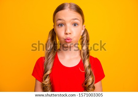 Closeup photo of charming pretty little lady inspired good mood sending air kisses classmate boy guy shy person wear casual red t-shirt isolated bright yellow color background