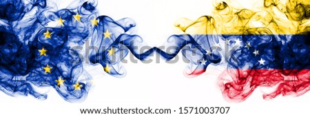 Eu, European Union vs Venezuela, Venezuelan smoky mystic flags placed side by side. Thick colored silky abstract smoke flags combination