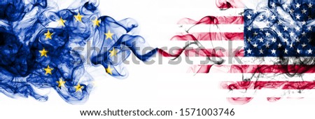 Eu, European Union vs United States of America, American, USA smoky mystic flags placed side by side. Thick colored silky abstract smoke flags combination