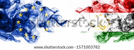Eu, European Union vs Tajikistan, Tajikistani smoky mystic flags placed side by side. Thick colored silky abstract smoke flags combination