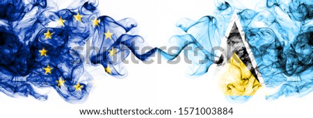 Eu, European Union vs Saint Lucia smoky mystic flags placed side by side. Thick colored silky abstract smoke flags combination