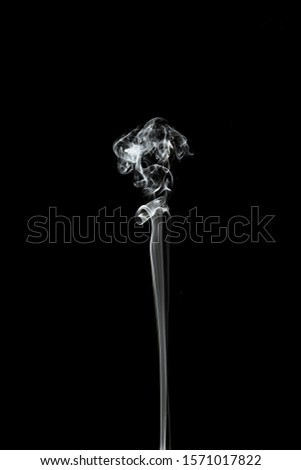 white smoke on black background. Royalty-Free Stock Photo #1571017822