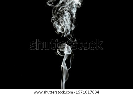 white smoke on black background. Royalty-Free Stock Photo #1571017834