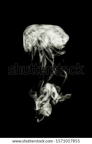 white smoke on black background. Royalty-Free Stock Photo #1571017855