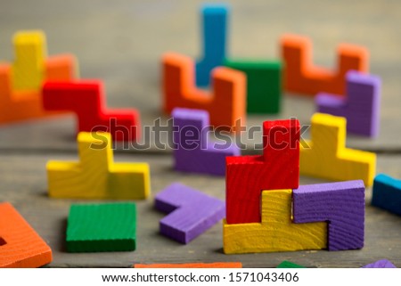 Creative solution for idea - business concept, jigsaw puzzle on the wooden background Royalty-Free Stock Photo #1571043406