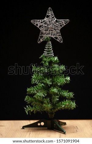 plastic fir tree with star decoration stock photo