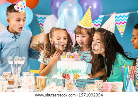 Little children celebrating Birthday at home Royalty-Free Stock Photo #1571092054