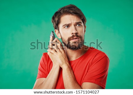 A man holds a smartphone in his hands an internet device communication service