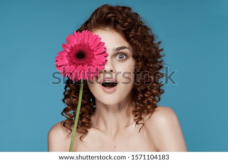 Beautiful curly hair woman charm flower blue smile model background