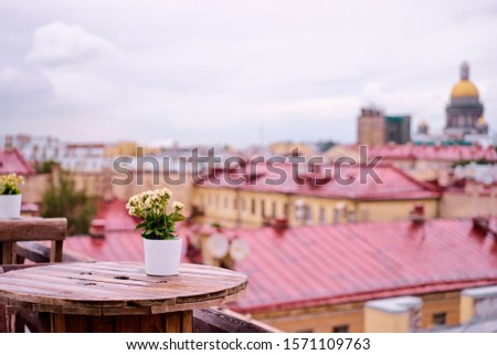 Cafe terrace on the roof top with beautiful view of Saint Peterburg old town.