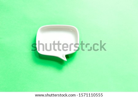 white Blank dialog speech bubble of the dish Isolated on green Background.