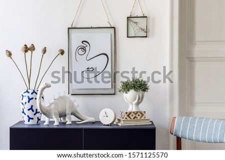 Stylish scandinavian living room with mock up poster frame, navy blue commode, plants, flowers in vase and elegant accessories. Modern home decor. Interior design. Template Ready to use. 