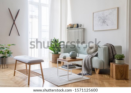 Stylish scandinavian living room with design mint sofa, furnitures, mock up poster map, plants and elegant personal accessories. Modern home decor. Bright and sunny room. Template Ready to use.  Royalty-Free Stock Photo #1571125600