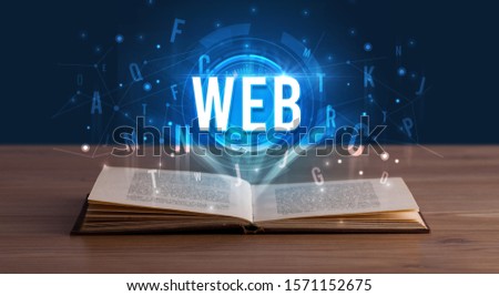 WEB inscription coming out from an open book, digital technology concept