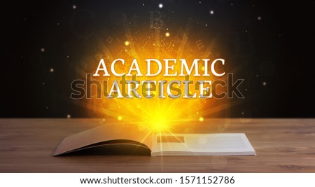 ACADEMIC ARTICLE inscription coming out from an open book, educational concept