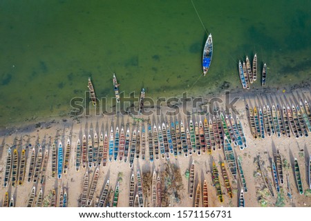 Aerial view of fishing village of Djiffer. Saloum Delta National Park, Joal Fadiout, Senegal. Africa. Photo made by drone from above. Royalty-Free Stock Photo #1571156731