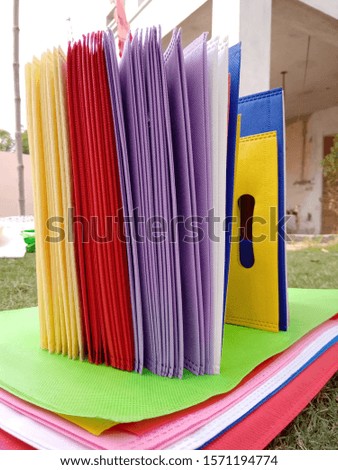 ECO Friendly Bags, Rainbow Colors of Non Woven Fabric Bags on Green Grass