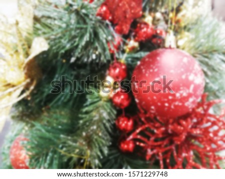 blurred background. Christmas balls on the Christmas tree, gifts, colorful background for cards, many objects. Christmas Background with bokeh light; Blurred Xmas background.