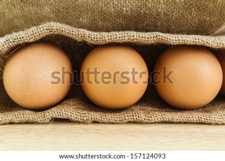chicken eggs on burlap for cooking