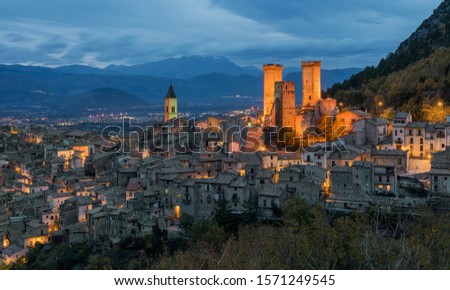 Illuminated Pacentro in the evening, medieval village in L'Aquila province, Abruzzo, central Italy. Royalty-Free Stock Photo #1571249545