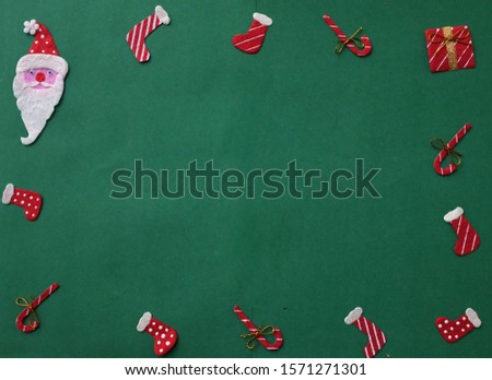 gift box ,candy and Santa Claus on green background decorations for Christmas new year concept