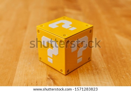 A little yellow box with a question mark on each face. Royalty-Free Stock Photo #1571283823