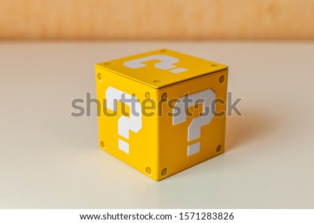 A little yellow box with a question mark on each face. Royalty-Free Stock Photo #1571283826