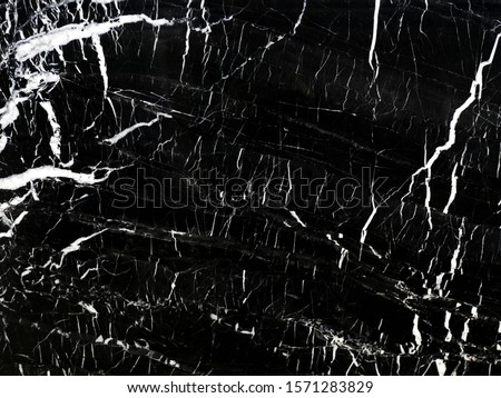 Black marble name Black Maquina ,abstract texture for interior design art work natural stone tile wallpaper luxurious background.Creative stone ceramic art wall backdrop with high resolution