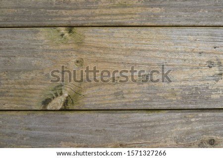 A plain, textured background. Ideal for an advertising agency. The wooden background is quite plain and would be an ideal background for slogans or images.