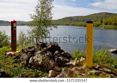 Norwegian Russian border at Kirkenes, Norway with Paatsjoki River Royalty-Free Stock Photo #1571335147