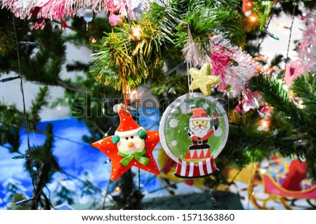 Decorated Christmas tree on blurred, sparkling and fairy bokeh background