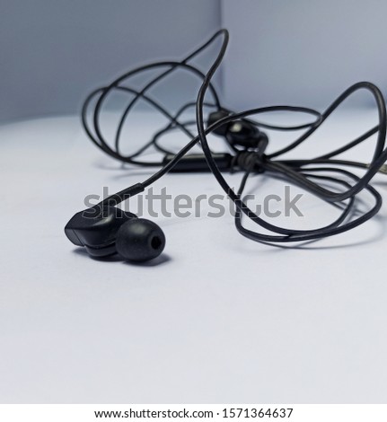 This tool in the form of a black cable and microphone called the handset.