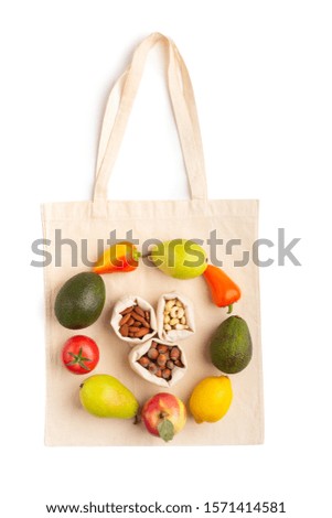 Healthy diet. Round picture of healthy products on zero waste cotton bag isolated on white background