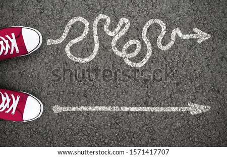 Hard Or Easy Way With Directional Arrows Pointing Two Directions Meaning Difficult And Simple Strategy Royalty-Free Stock Photo #1571417707