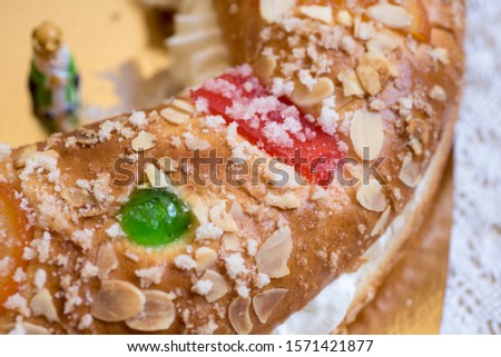 Christmas cake, with cream, almonds, sugar and candied fruits