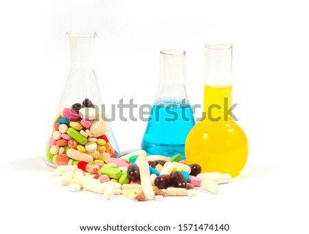 chemical reagents in test tubes and medicinal tablets