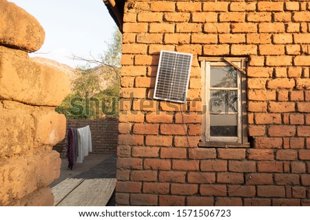 Solar panel for home use rural Malawi Royalty-Free Stock Photo #1571506723