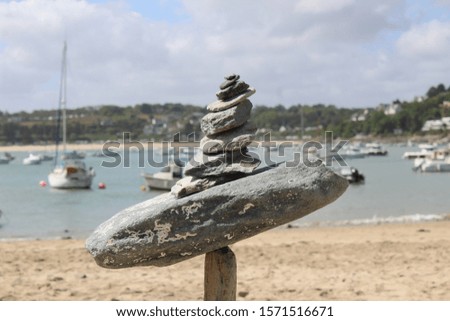 A close shot of rocks balancing on each other with a blurred background
