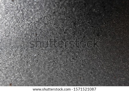 Silver glitter shiny background with selective focus. New Year or Christmas wrapping holiday paper texture, horizontal format