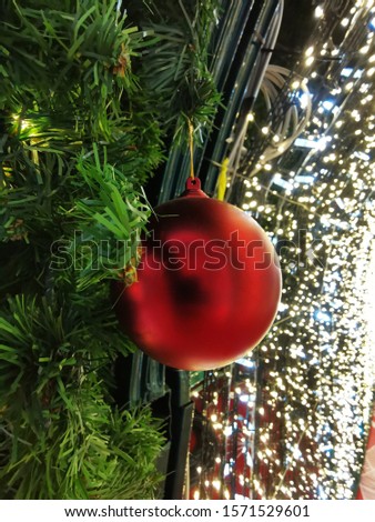 Beautiful Christmas decorations with snowflakes lights and ornaments. Christmas trees decorated with sparkling balls and glitter objects. Xmas greeting cards background.