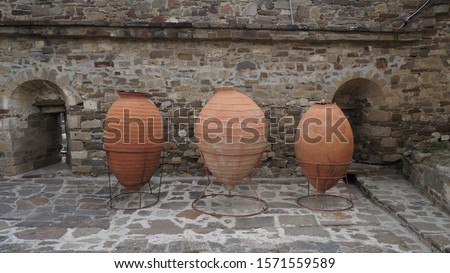 Antique amphoras in the Genoa fortress in Sudak, Republic of Crimea Royalty-Free Stock Photo #1571559589