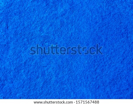 blue decorative plaster background , stucco wall with copyspace , color abstraction , wallpaper close up , azure granite macro