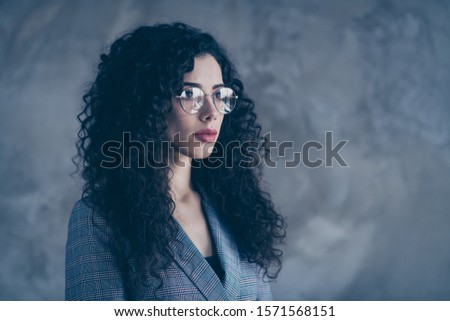 Close-up profile side view portrait of her she nice-looking attractive charming lovely content calm wavy-haired girl expert director lawyer isolated over gray concrete wall background