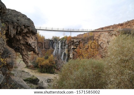 A long suspension bridge over the river.