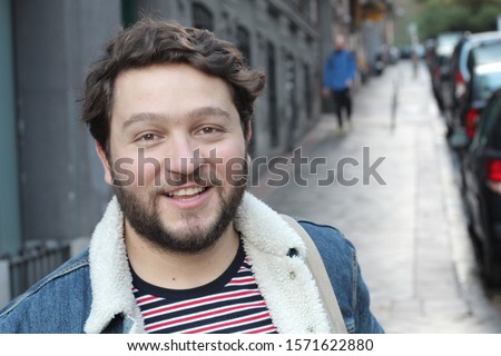 Real looking healthy guy smiling outdoors Royalty-Free Stock Photo #1571622880