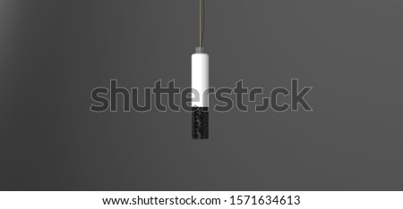 Tube shape lamp hangs in the dark room 